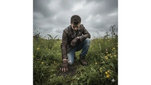 10 Cinematic Google Gemini AI Photo Editing Prompts for Boys to Capture Moody Portraits in Lush Green Fields image